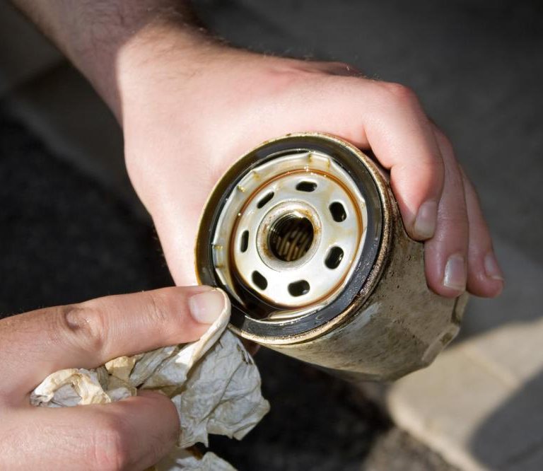 Mechanic cleaning old oil filters