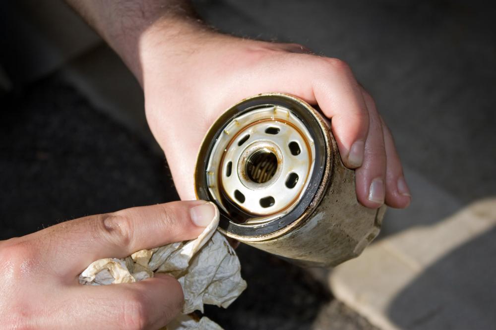 Mechanic cleaning old oil filters